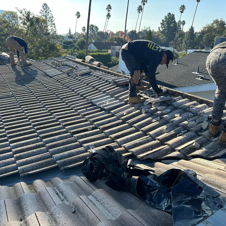 KGR crew removing and relaying tiles on a South Florida tile roof during a replacement